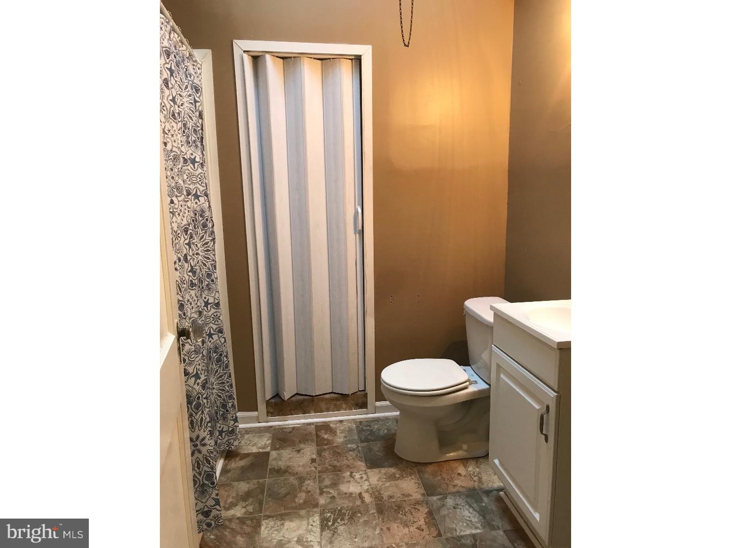 212 Wembly Road Upper Darby, PA 19082 - Photo 10 of 12 a bathroom with a toilet and a shower