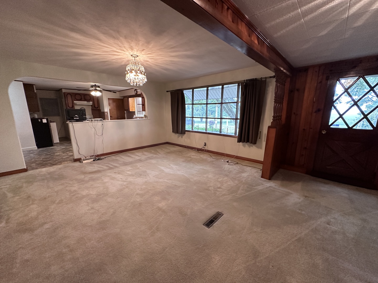 12454 Cracker Road Farmer City, IL 61842 - Photo 12 of 23 en empty room with windows and ceiling fan