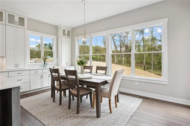 a view of a dining room with furniture window and outside view