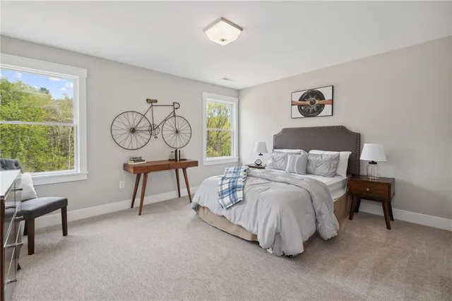 a bedroom with a bed and a table