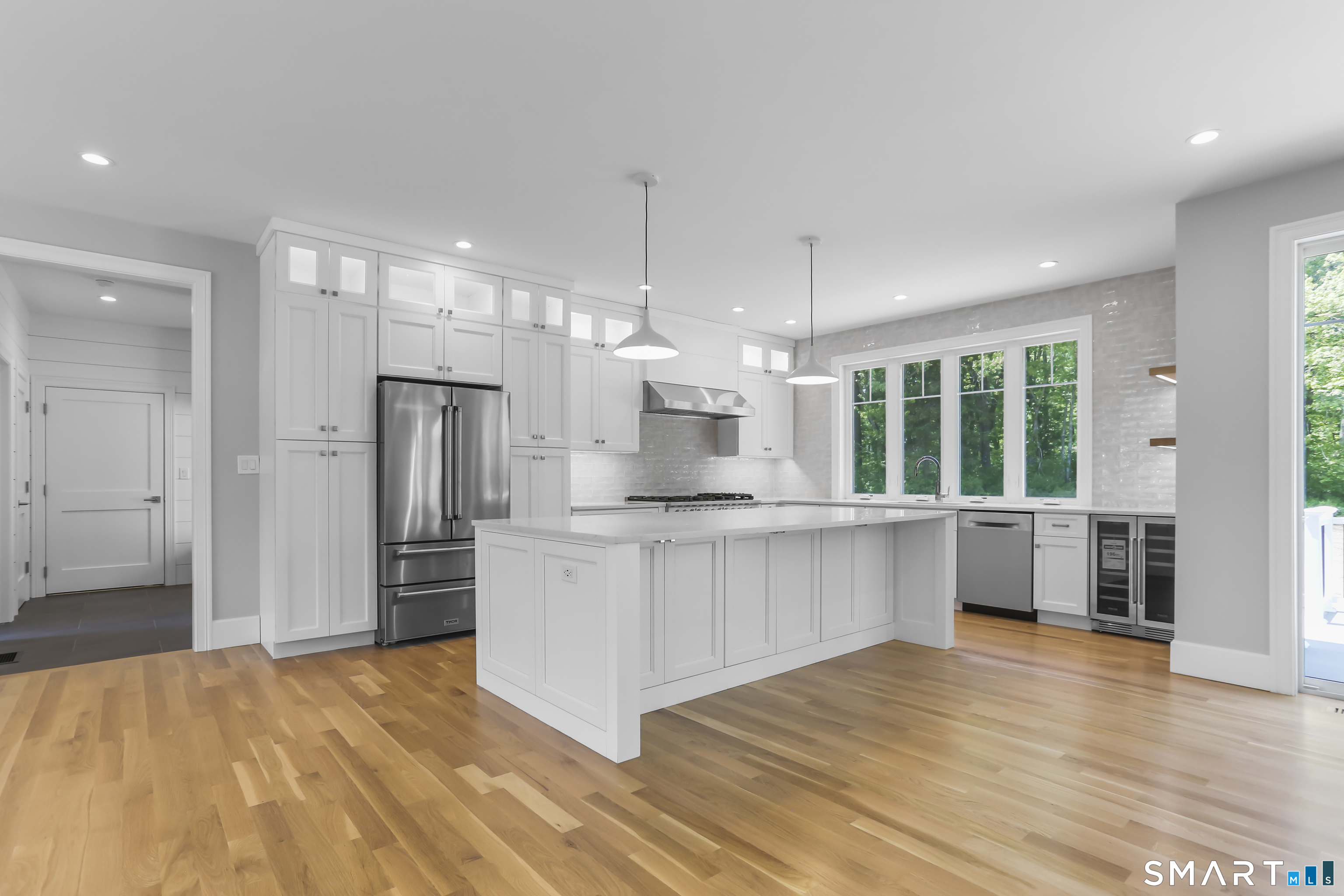 110 Porters Hill Road Trumbull, CT 06611 - Photo 14 of 47 a kitchen with stainless steel appliances a refrigerator sink and cabinets