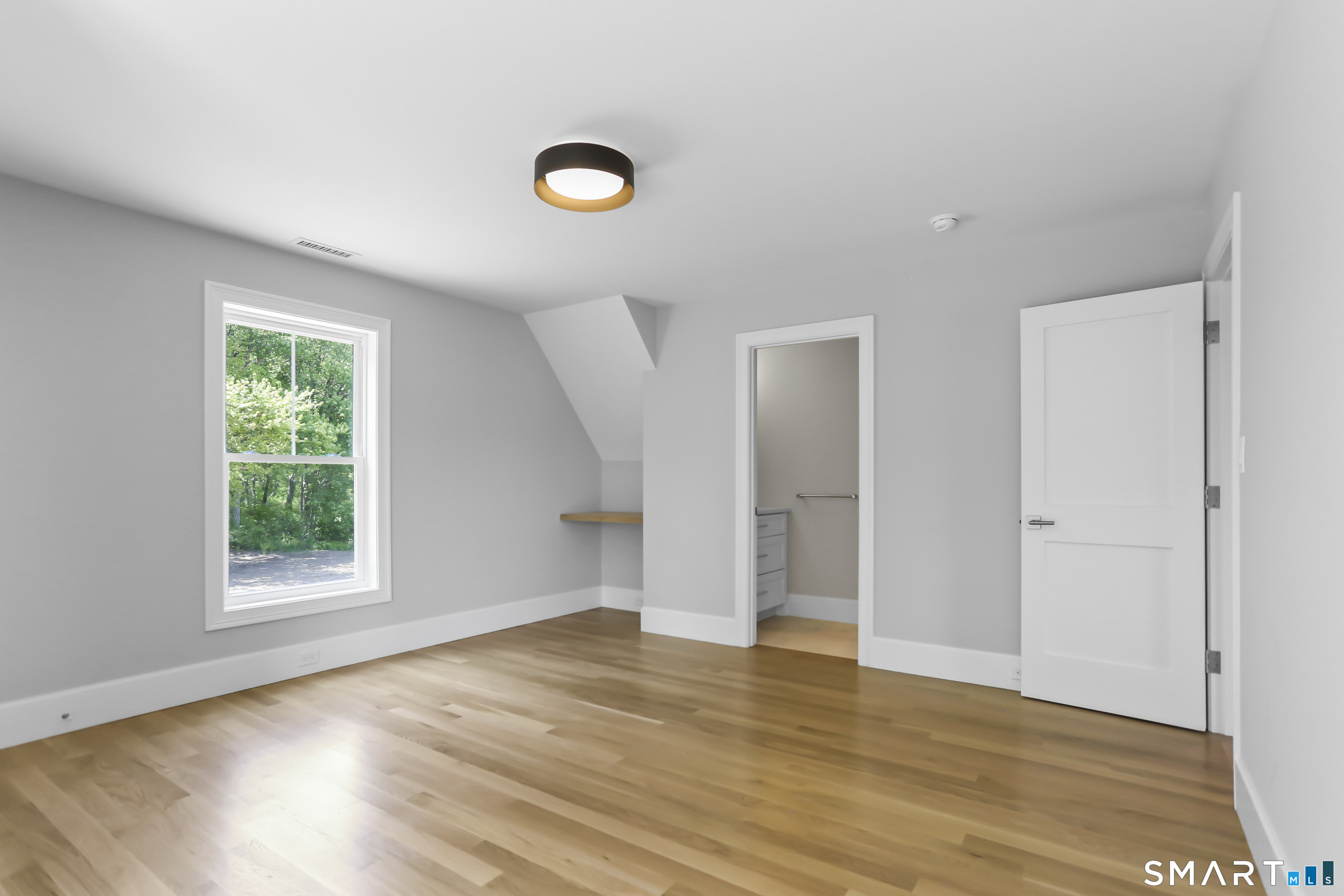 110 Porters Hill Road Trumbull, CT 06611 - Photo 19 of 47 an empty room with wooden floor and windows