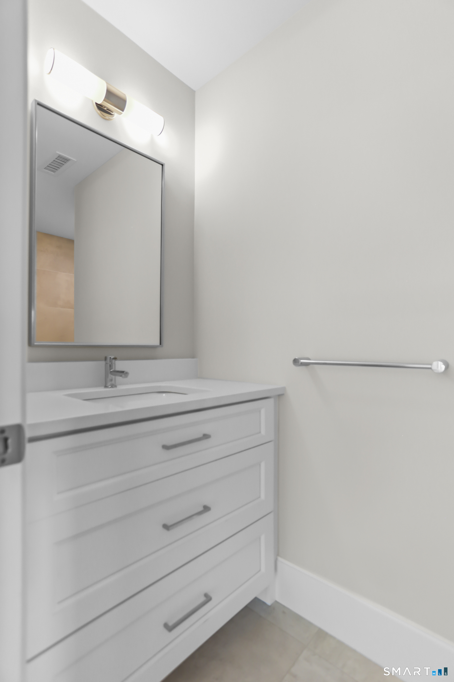 110 Porters Hill Road Trumbull, CT 06611 - Photo 20 of 47 a bathroom with a sink vanity and mirror