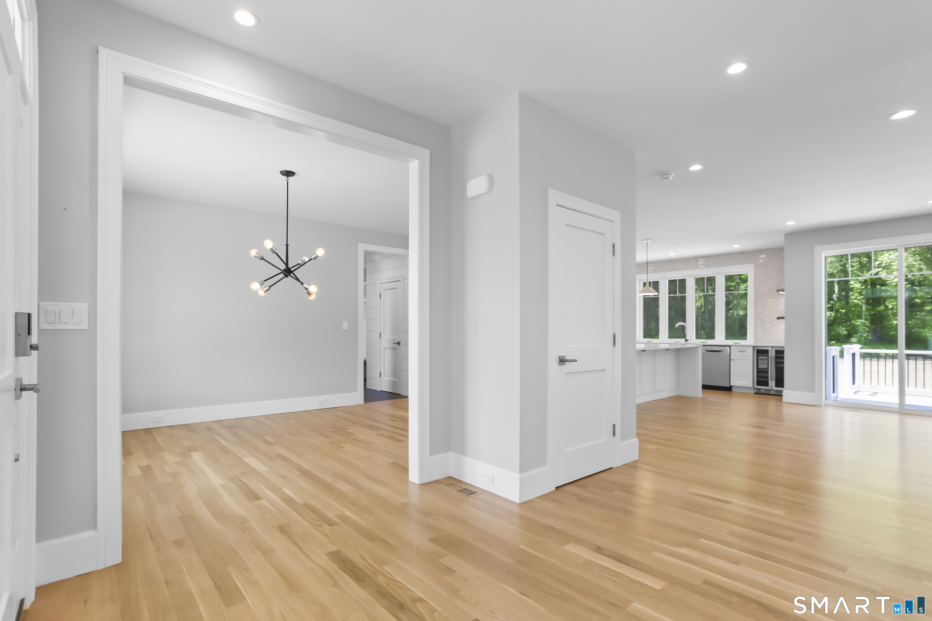 110 Porters Hill Road Trumbull, CT 06611 - Photo 2 of 47 an empty room with wooden floor and windows