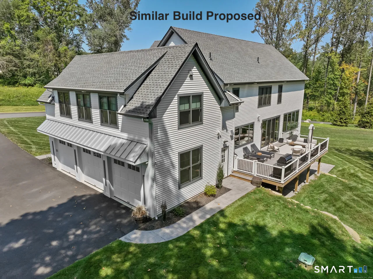 110 Porters Hill Road Trumbull, CT 06611 - Photo 21 of 21 a aerial view of a house with a yard table and chairs