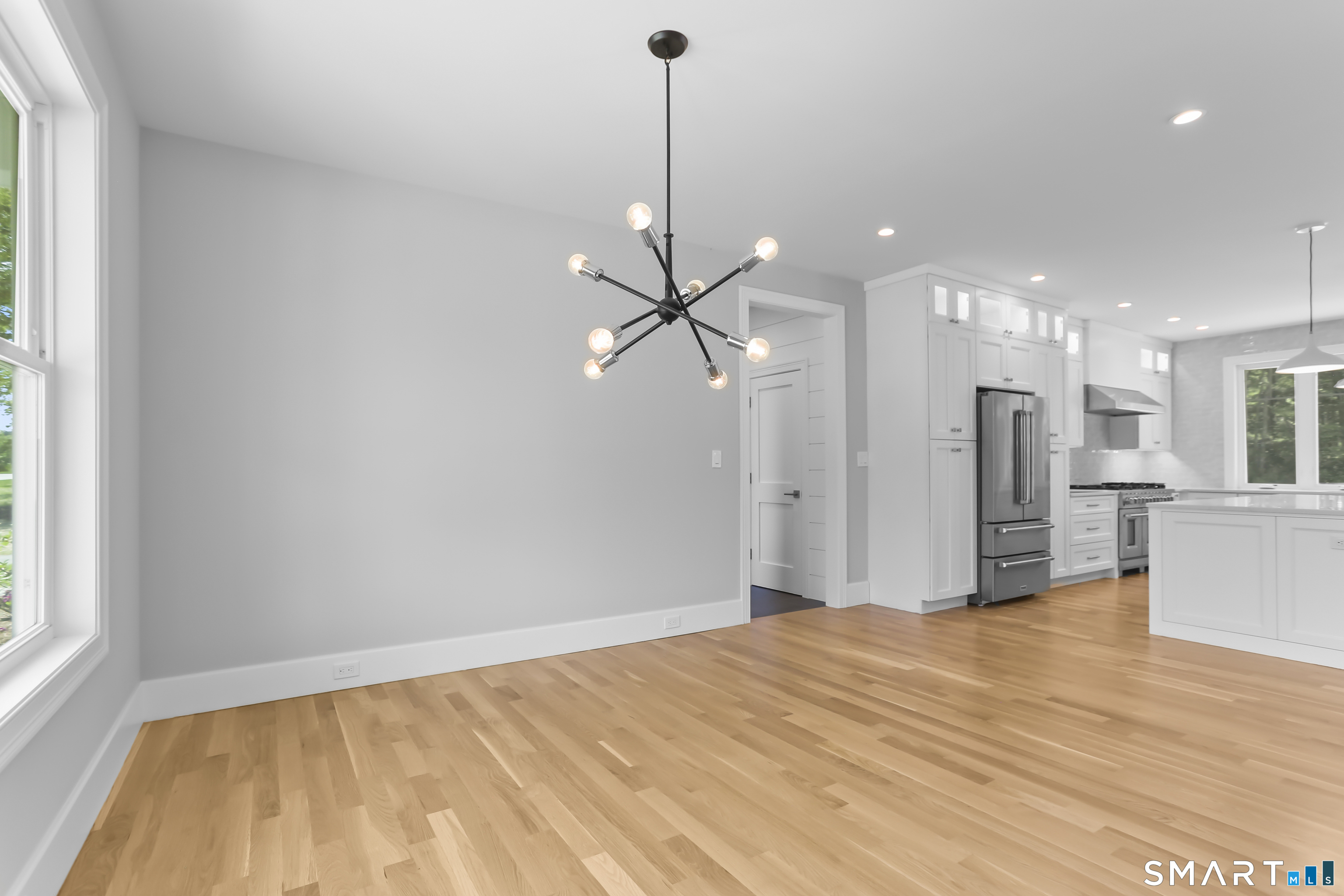 110 Porters Hill Road Trumbull, CT 06611 - Photo 3 of 47 a view of a room with a chandelier fan and windows