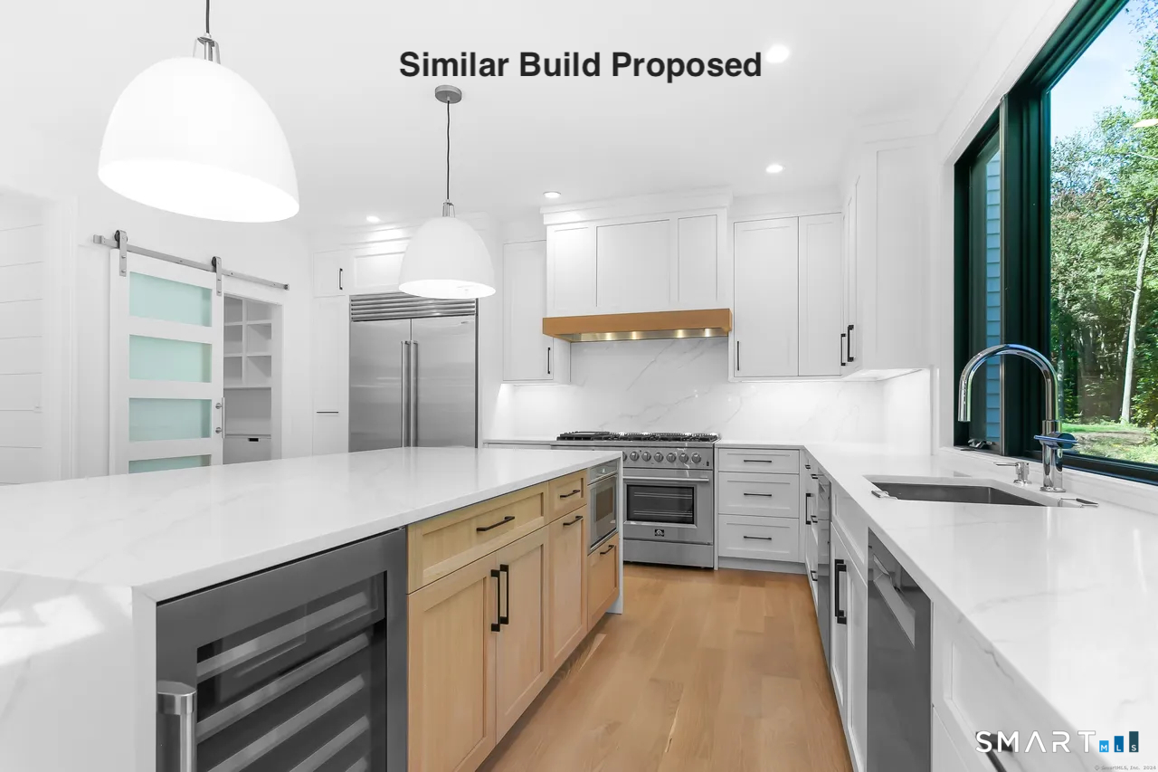 110 Porters Hill Road Trumbull, CT 06611 - Photo 35 of 47 a kitchen with a sink stove and refrigerator