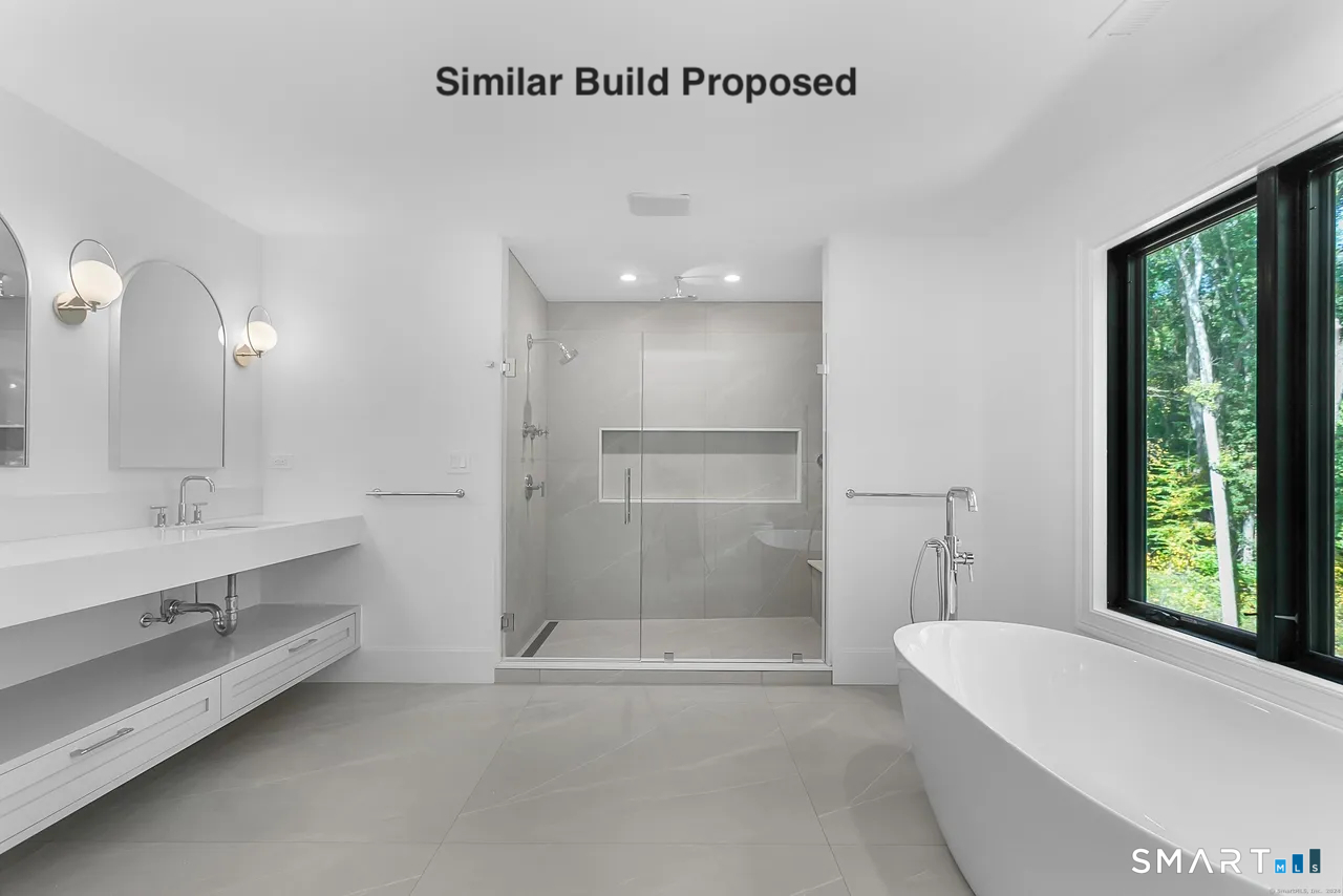 110 Porters Hill Road Trumbull, CT 06611 - Photo 42 of 47 a bathroom with a bathtub a mirror a sinks and a shower