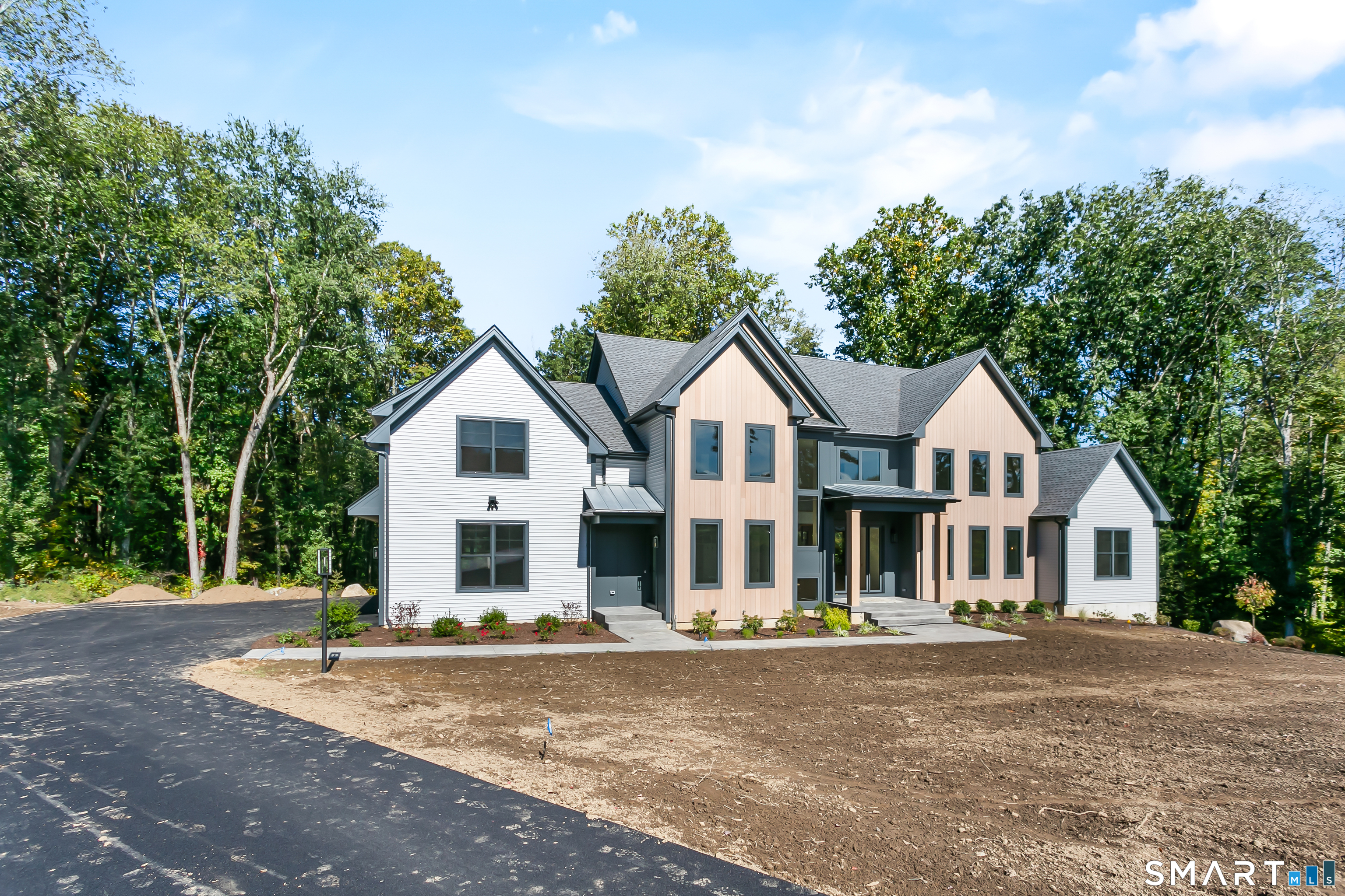 110 Porters Hill Road Trumbull, CT 06611 - Photo 8 of 47 a view of a white house with a yard and large trees