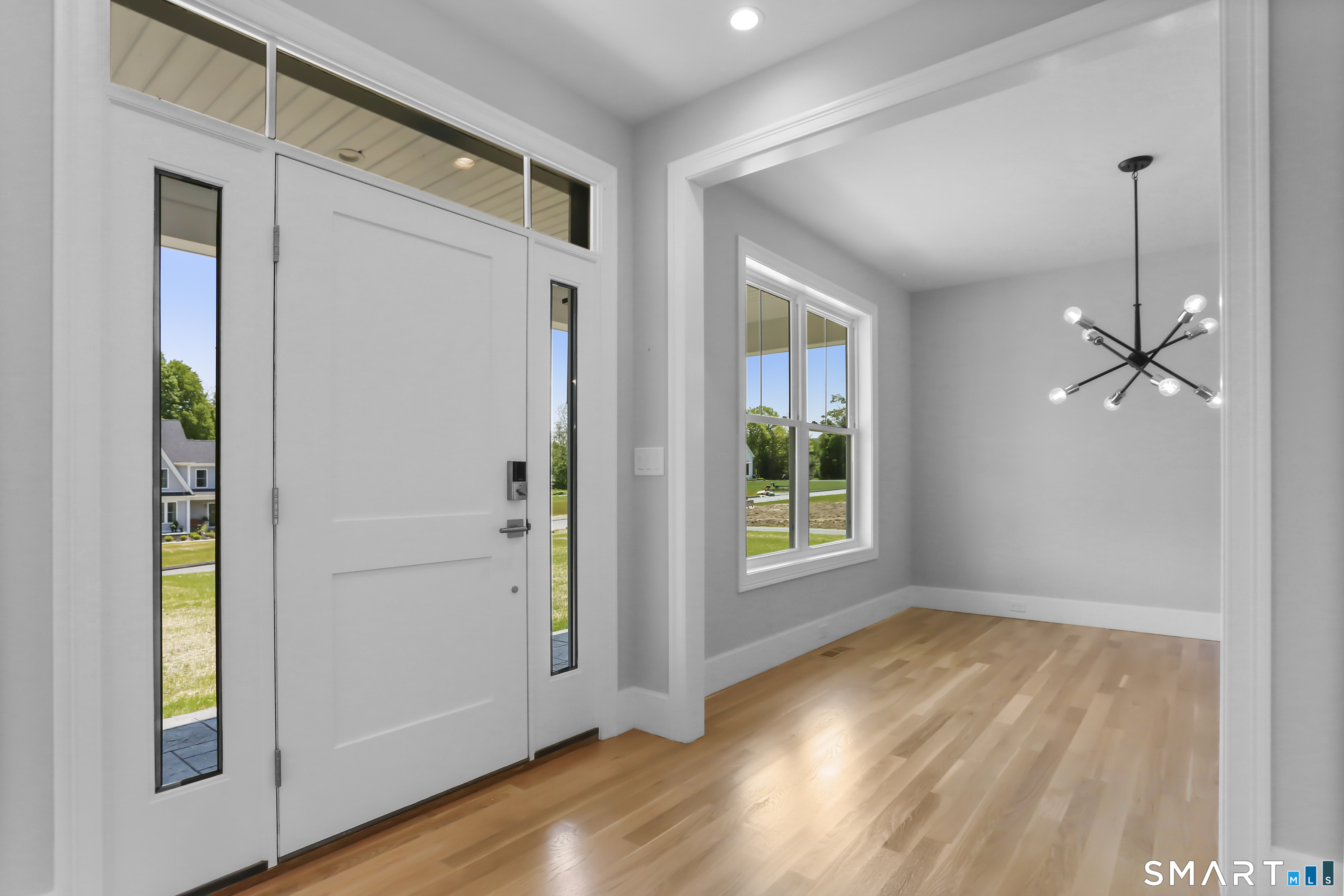 110 Porters Hill Road Trumbull, CT 06611 - Photo 9 of 47 a view of an empty room with window and wooden floor