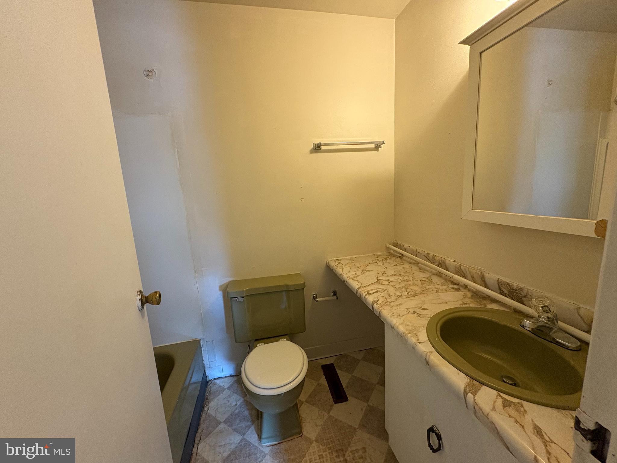 1007 Timber Creek Road Clementon, NJ 08021 - Photo 13 of 13 a bathroom with a sink a washer and dryer