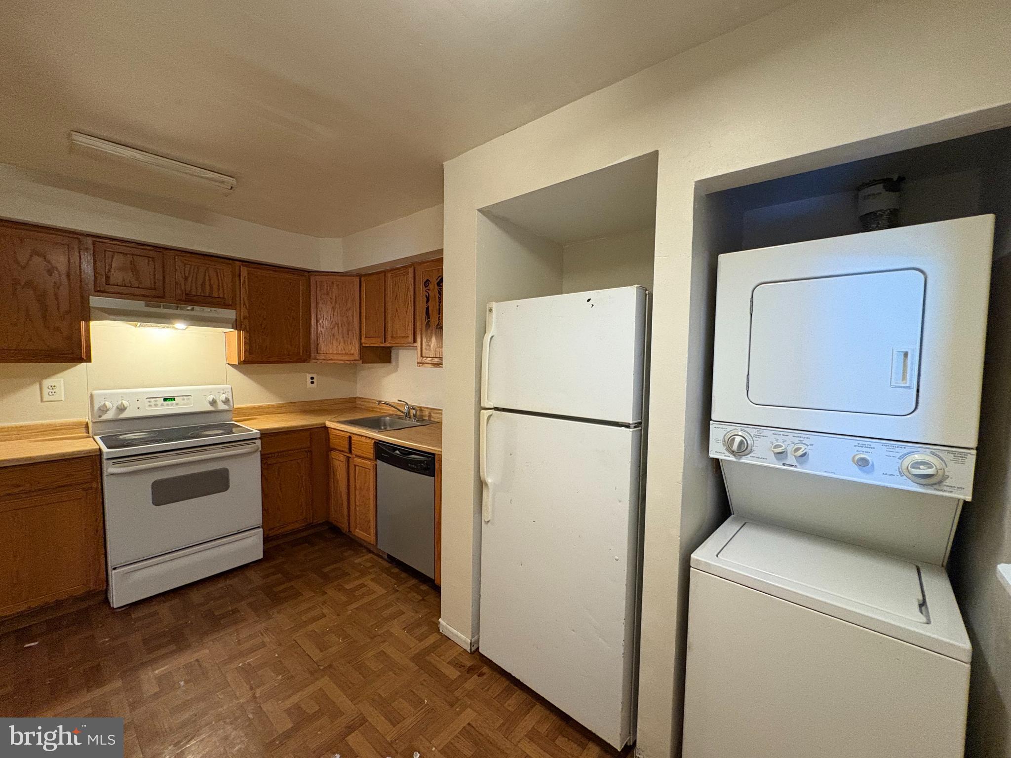 1007 Timber Creek Road Clementon, NJ 08021 - Photo 6 of 13 a kitchen with a refrigerator sink stove and cabinets