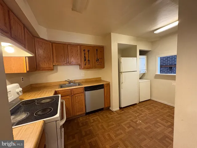 a kitchen with a refrigerator stove and microwave