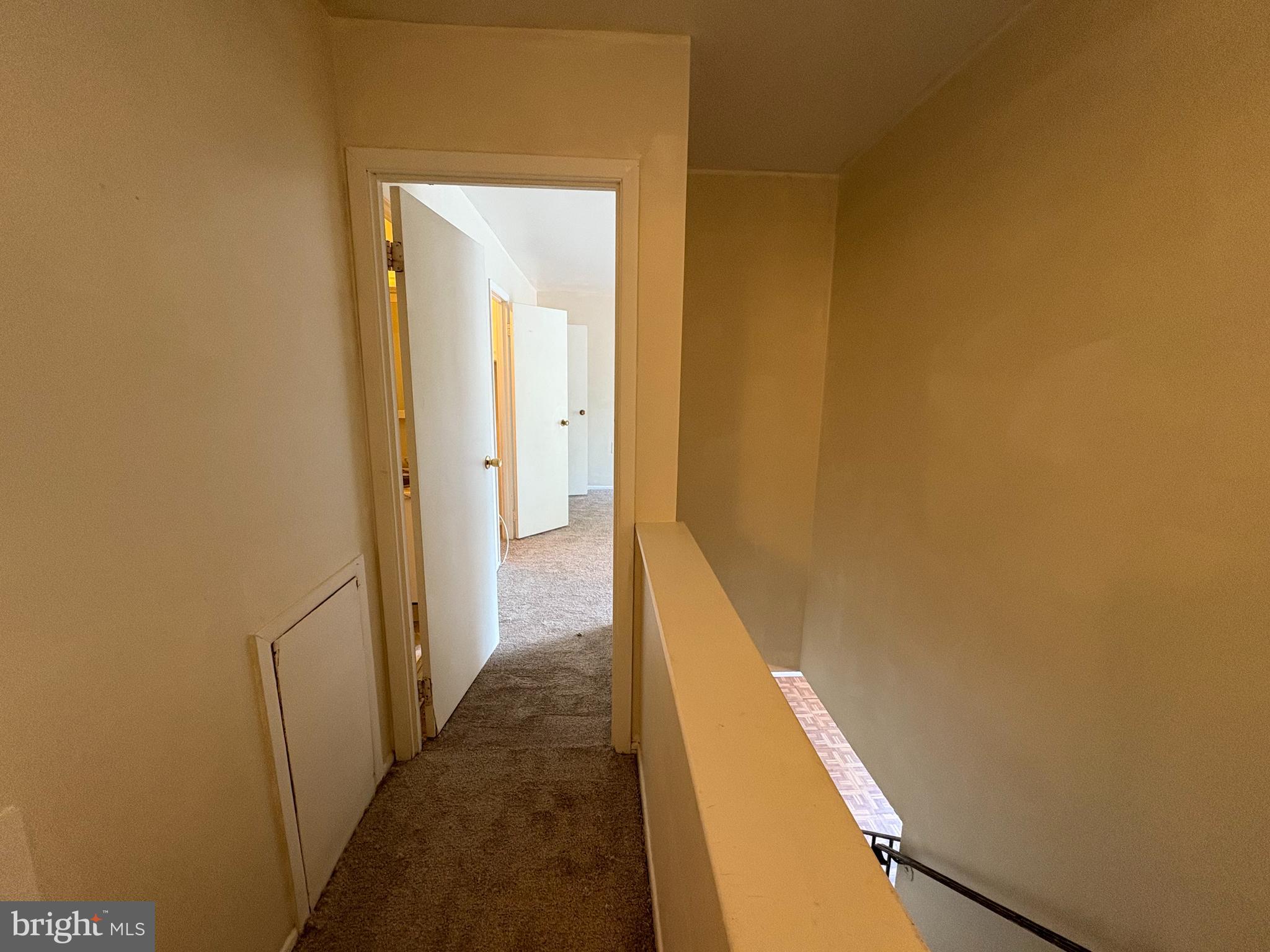 1007 Timber Creek Road Clementon, NJ 08021 - Photo 10 of 13 a view of a hallway with a yellow walls