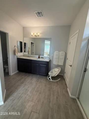 a room with furniture and wooden floor