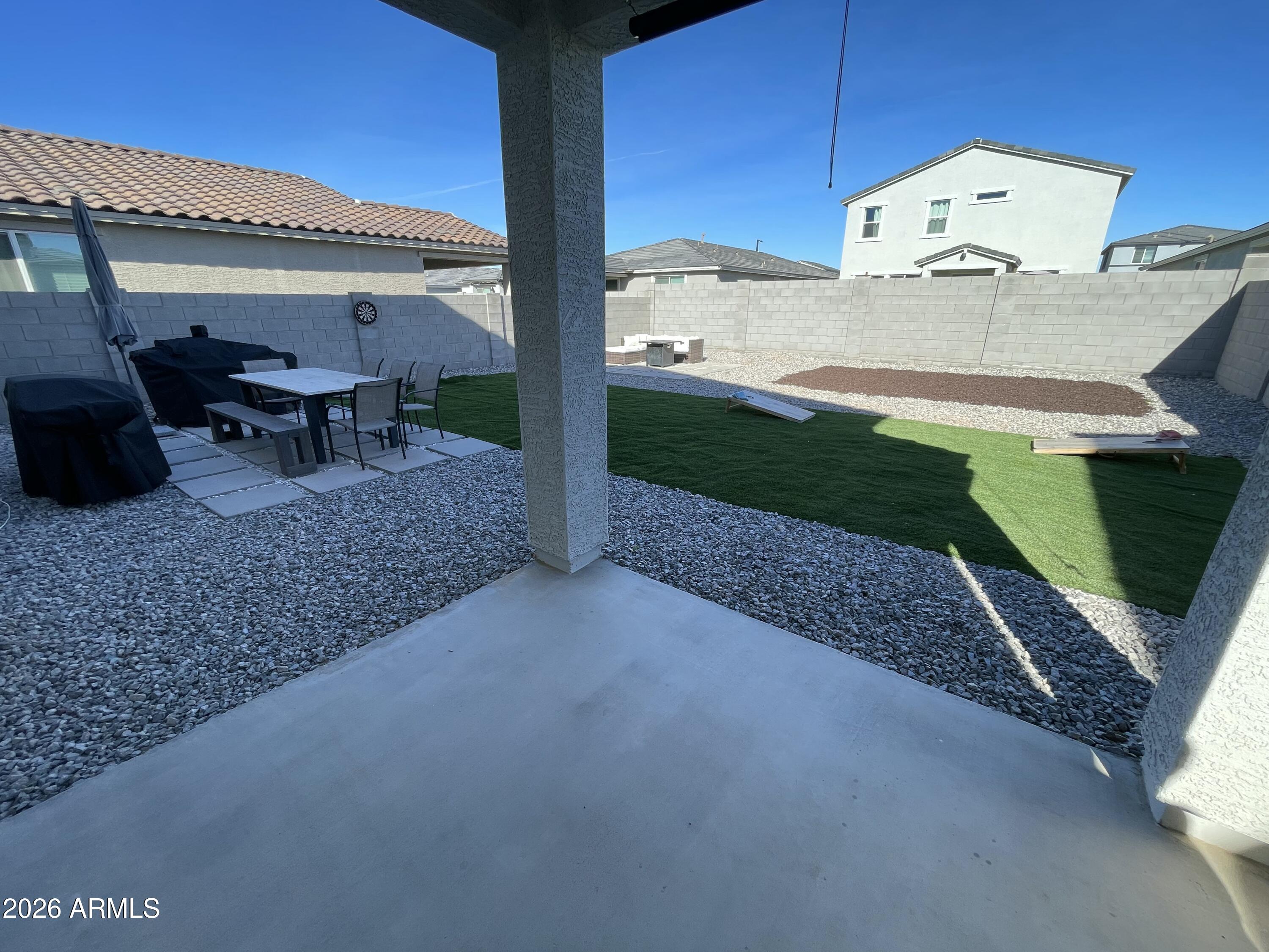 18140 West Daley Lane Surprise, AZ 85387 - Photo 17 of 23 a view of a backyard with furniture