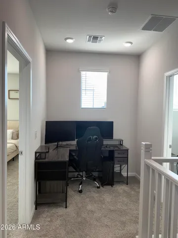 a view of a workspace with furniture