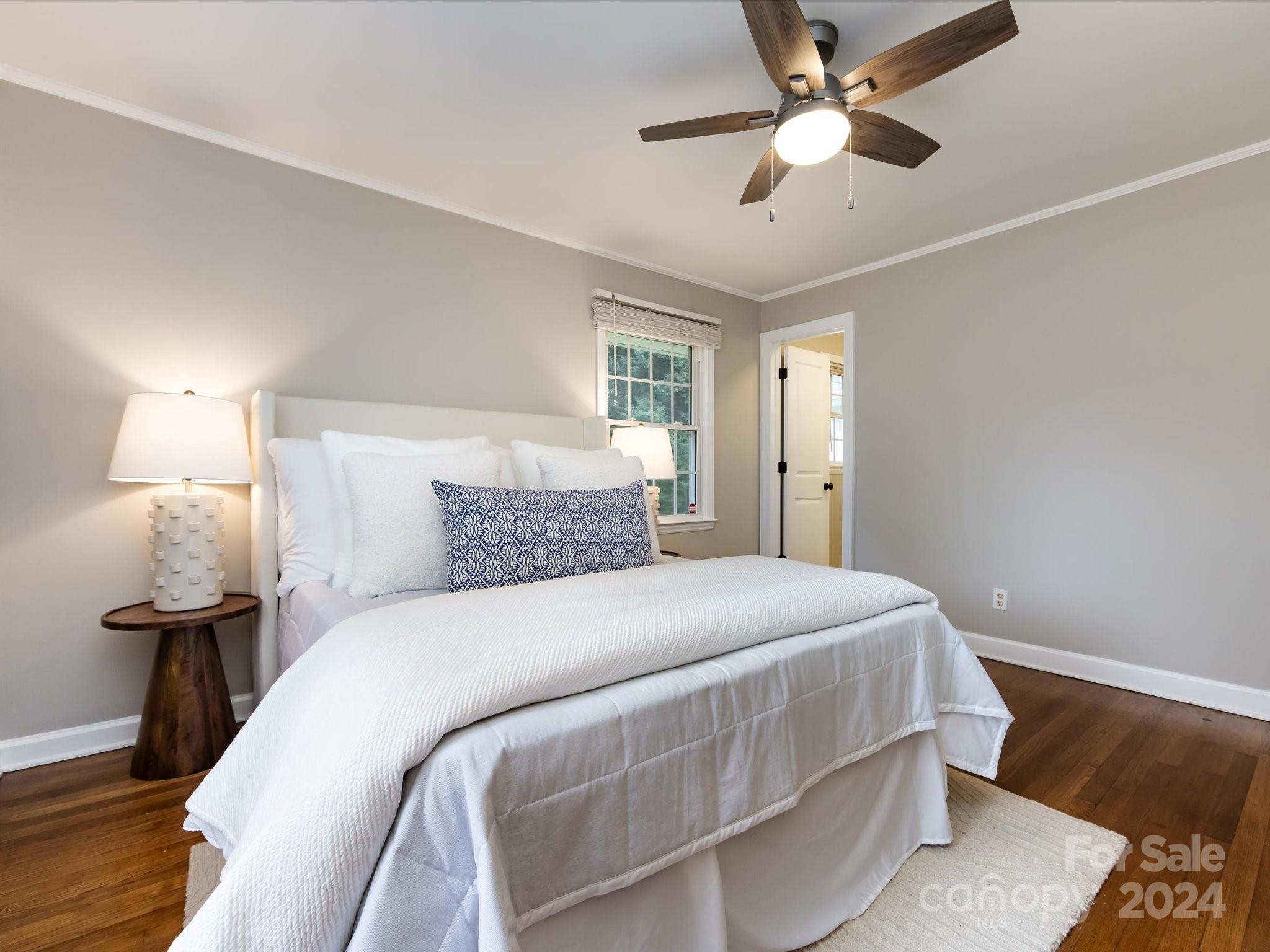 3133 Spring Valley Road Charlotte, NC 28210 - Photo 15 of 25 a bedroom with a bed and a lamp