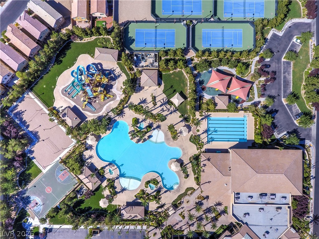 489 Foster Springs Road Las Vegas, NV 89148 - Photo 28 of 30 An aerial perspective reveals a vibrant community with recreational amenities and residential properties.