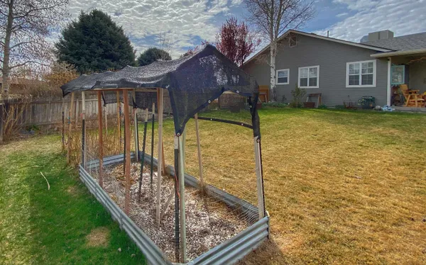 a view of a backyard with a garden
