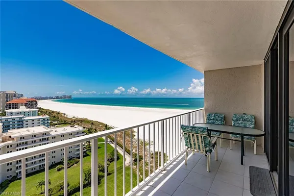 a view of a balcony with furniture