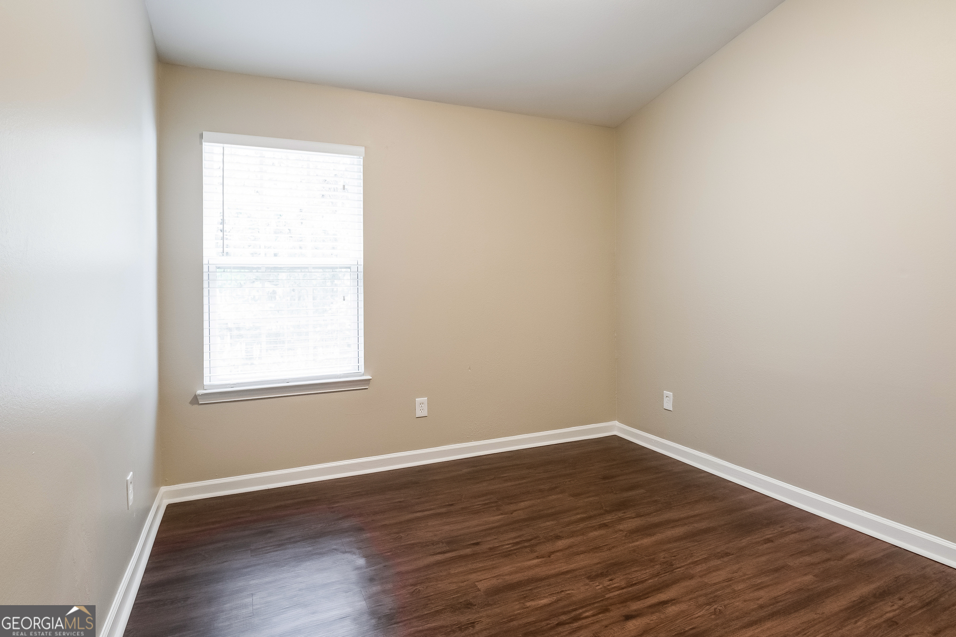 2839 Windsor Forrest Court College Park, GA 30349 - Photo 12 of 15 an empty room with wooden floor and windows
