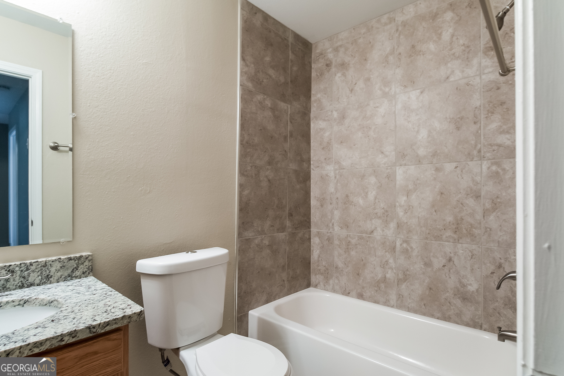 2839 Windsor Forrest Court College Park, GA 30349 - Photo 13 of 15 a white toilet sitting next to a bath tub