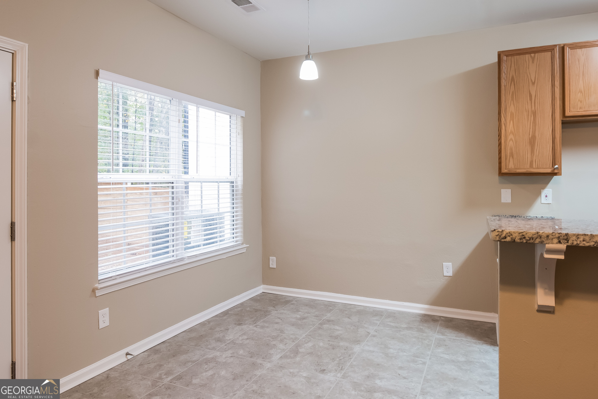 2839 Windsor Forrest Court College Park, GA 30349 - Photo 4 of 15 a view of a kitchen with wooden floor and a window