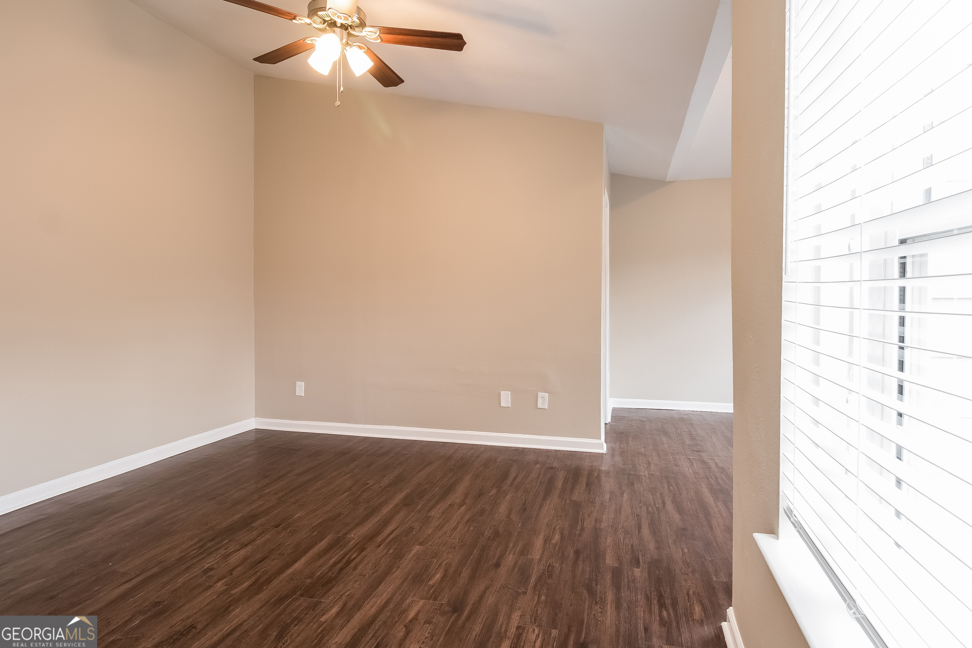 2839 Windsor Forrest Court College Park, GA 30349 - Photo 9 of 15 wooden floor in an empty room with a window