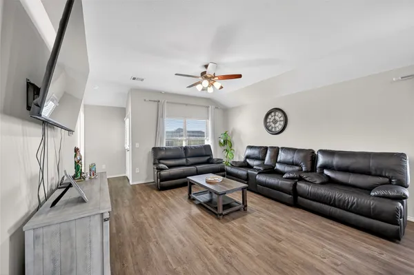 a living room with furniture and a window