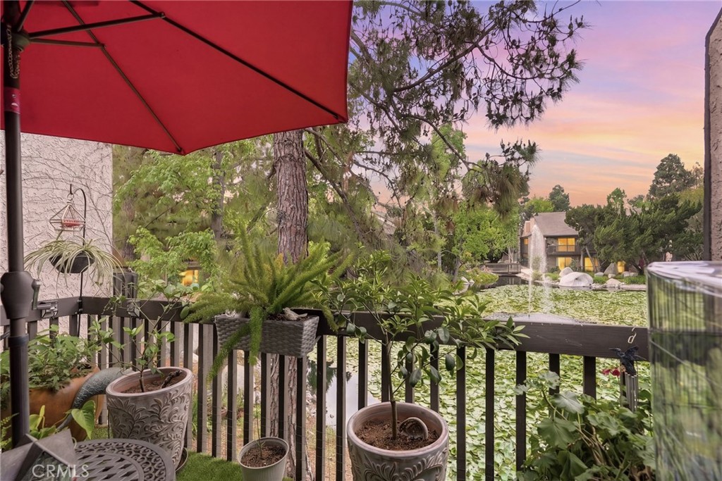 7890 East Spring Street, Unit 2L Long Beach, CA 90815 - Photo 3 of 47 a view of a chairs and table in the patio