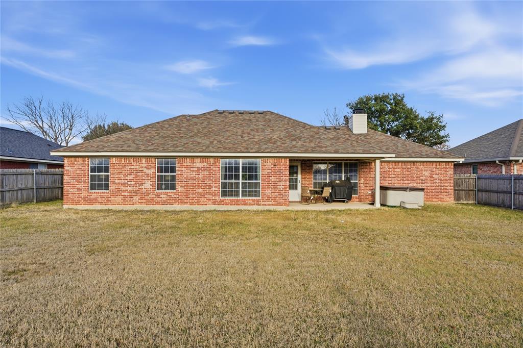 10504 Whitney Trace Drive Waco, TX 76708 - Photo 22 of 24 front view of a house with a yard