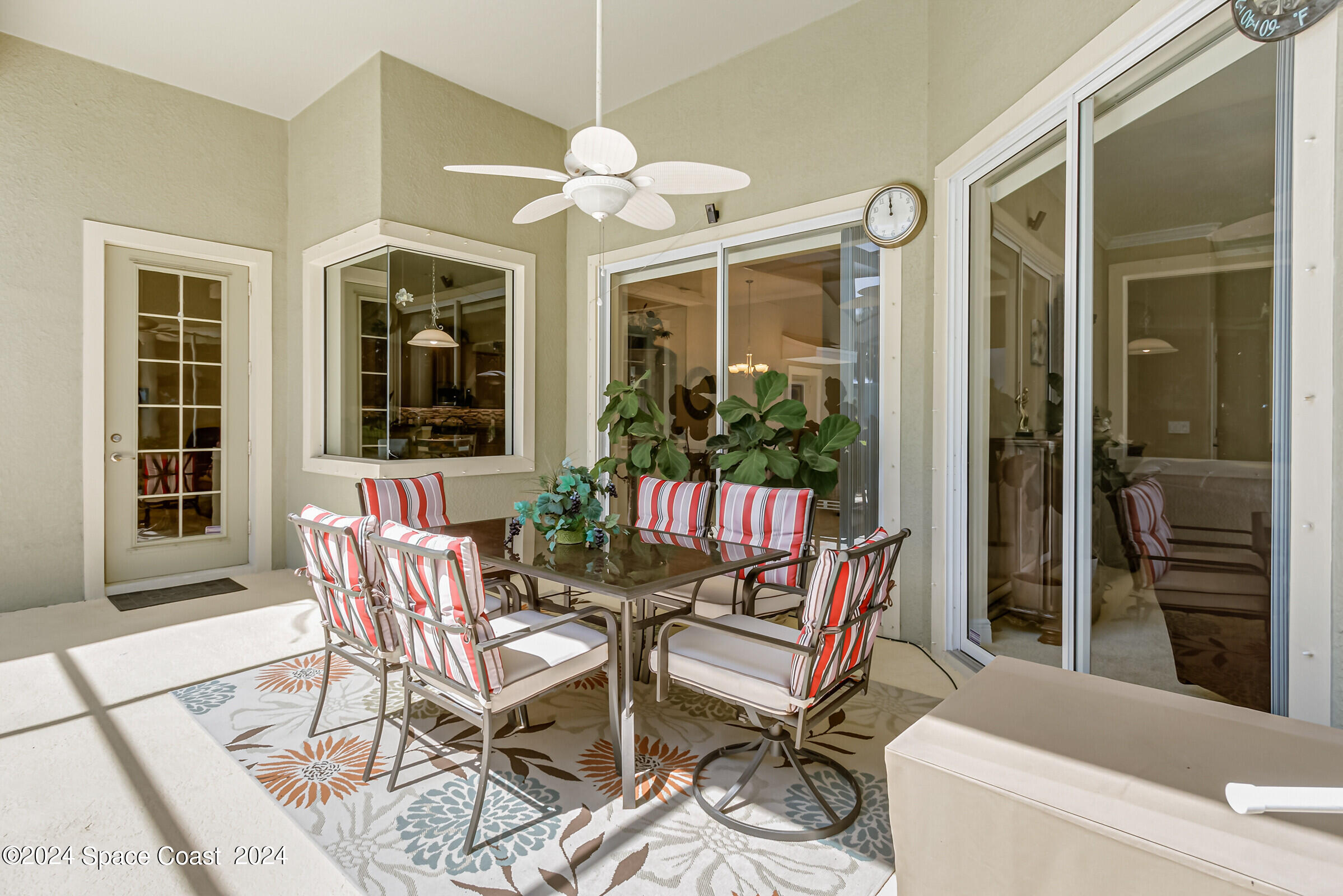 5972 Goleta Circle Melbourne, FL 32940 - Photo 12 of 56 a view of a dining room with furniture and chandelier