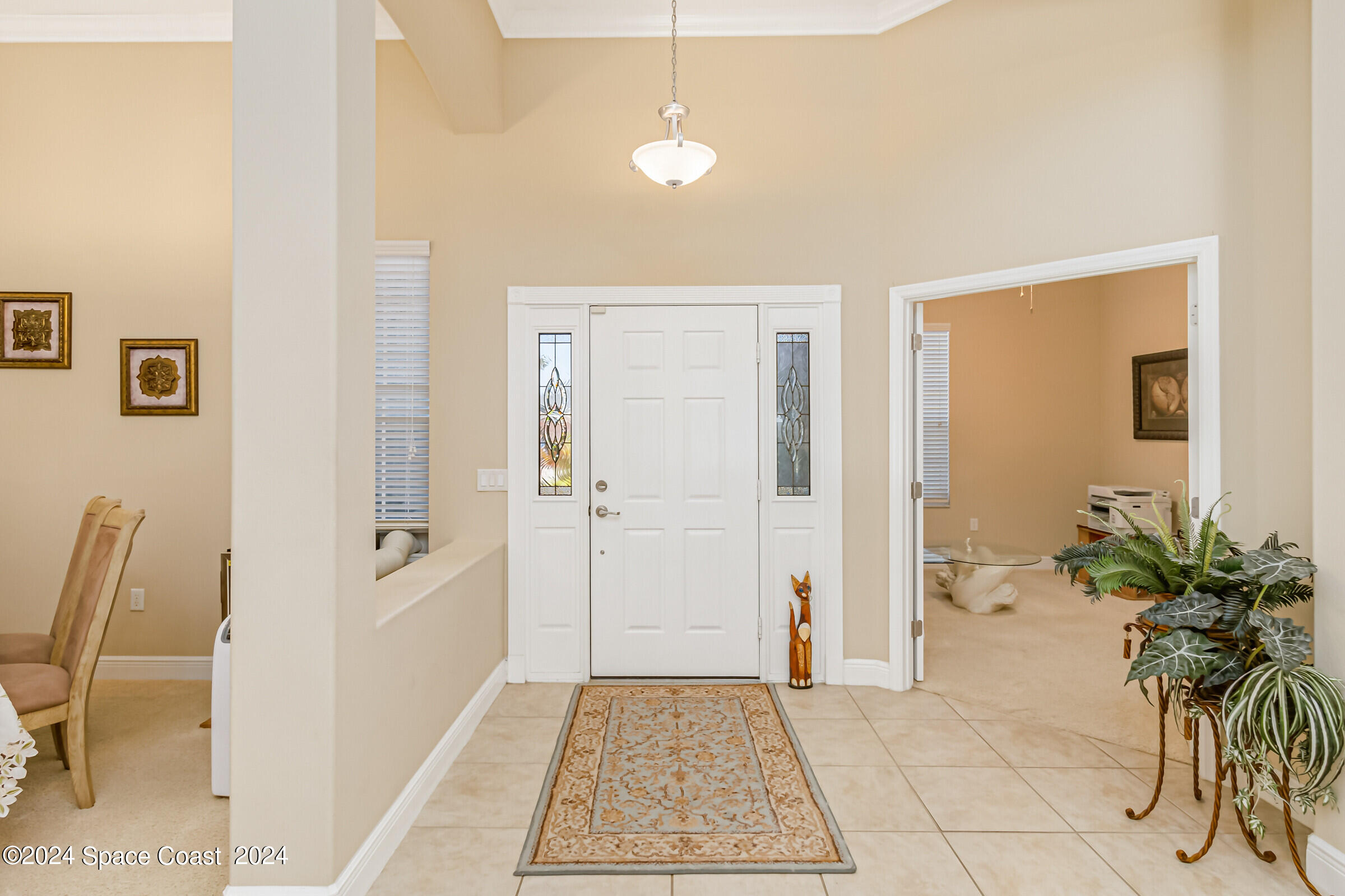 5972 Goleta Circle Melbourne, FL 32940 - Photo 14 of 56 a view of a livingroom with a dinning area hardwood floor and a sink