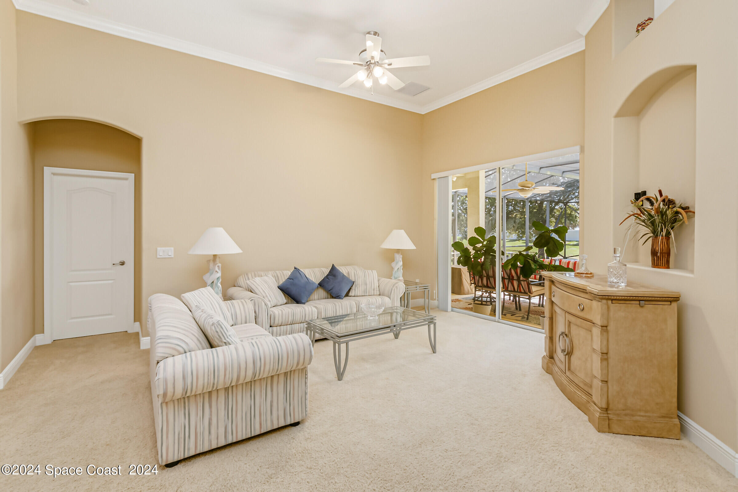 5972 Goleta Circle Melbourne, FL 32940 - Photo 15 of 56 a living room with furniture and a chandelier