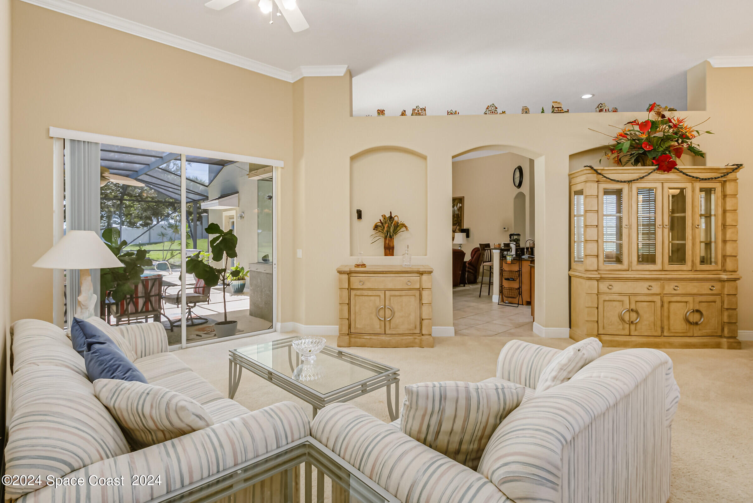 5972 Goleta Circle Melbourne, FL 32940 - Photo 16 of 56 a living room with furniture and a chandelier