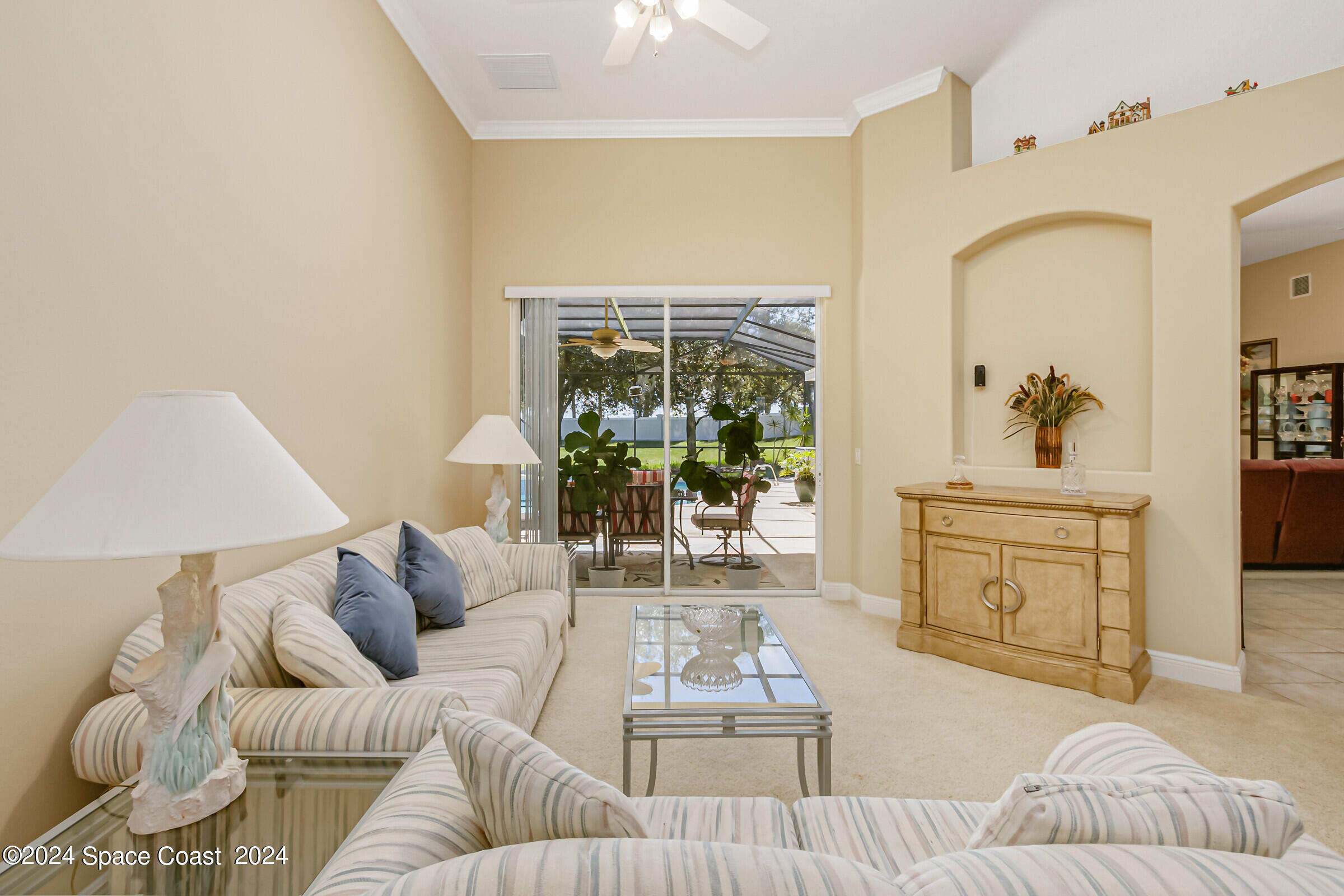 5972 Goleta Circle Melbourne, FL 32940 - Photo 19 of 56 a living room with furniture and a window