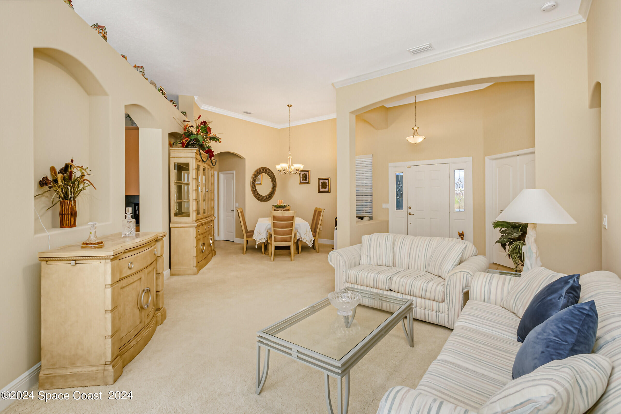 5972 Goleta Circle Melbourne, FL 32940 - Photo 20 of 56 a living room with furniture and a large window