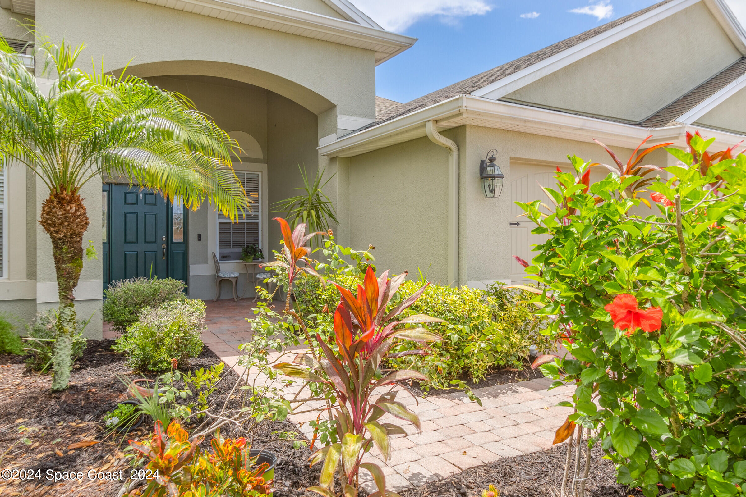 5972 Goleta Circle Melbourne, FL 32940 - Photo 2 of 56 a front view of a house with a yard