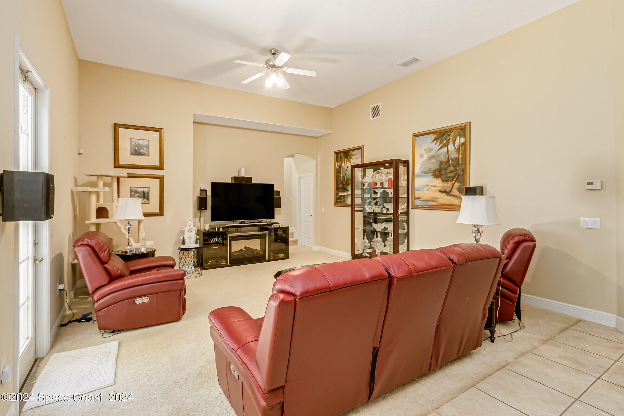 5972 Goleta Circle Melbourne, FL 32940 - Photo 28 of 56 a living room with furniture and a flat screen tv