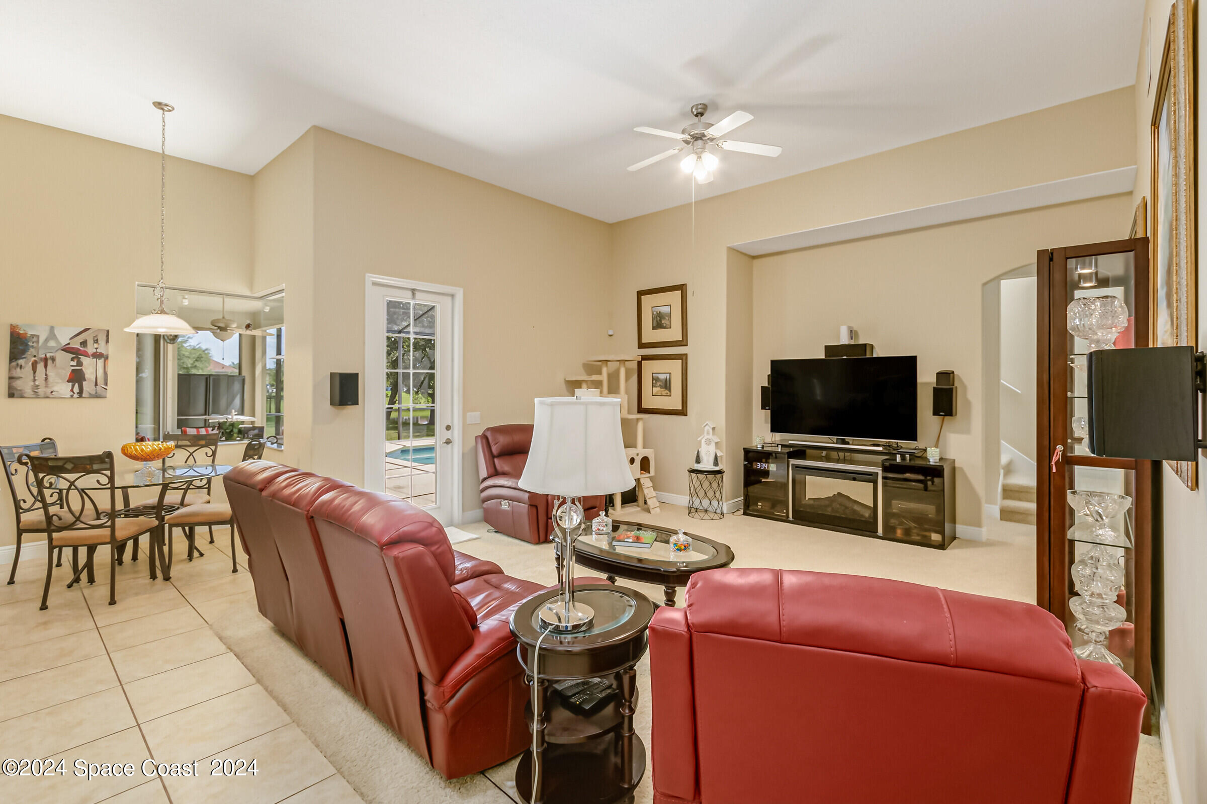 5972 Goleta Circle Melbourne, FL 32940 - Photo 29 of 56 a living room with furniture and a flat screen tv