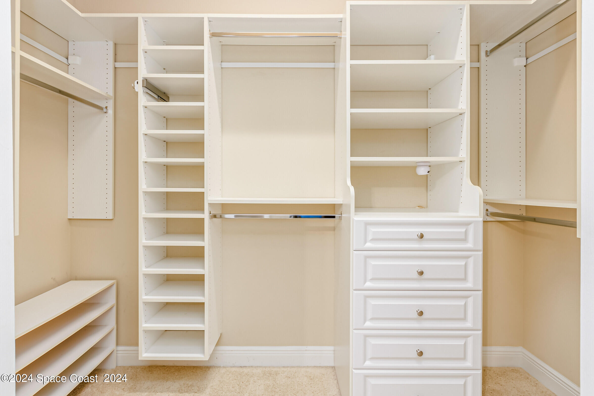 5972 Goleta Circle Melbourne, FL 32940 - Photo 35 of 56 a view of walk in closet with empty racks