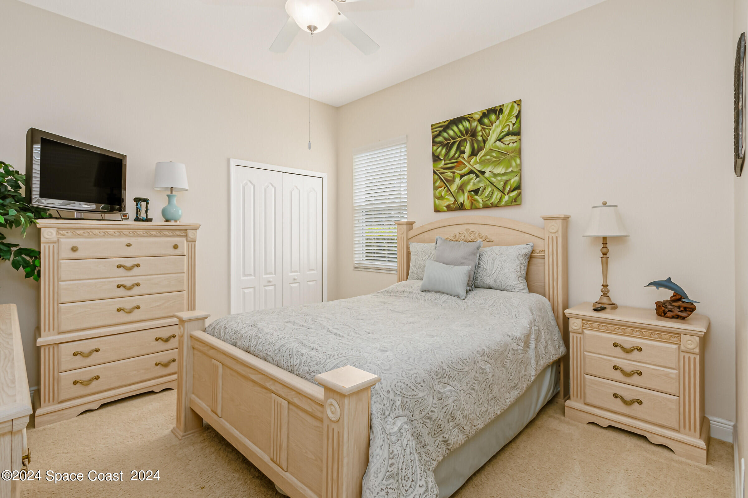 5972 Goleta Circle Melbourne, FL 32940 - Photo 42 of 56 a bedroom with a bed and furniture