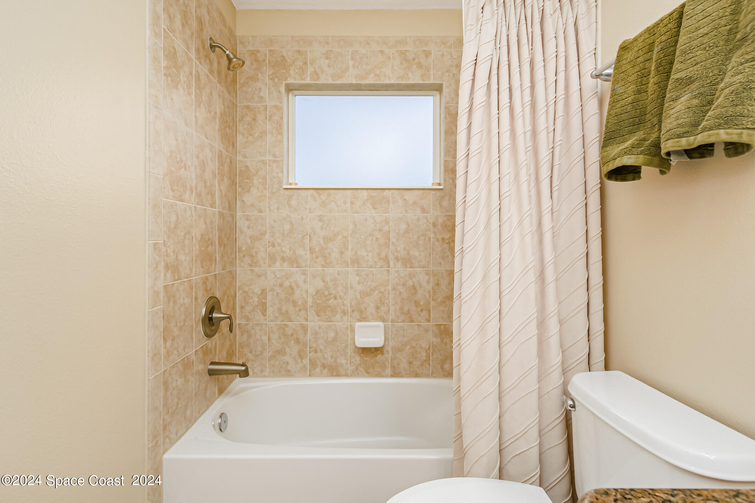 5972 Goleta Circle Melbourne, FL 32940 - Photo 49 of 56 a bathroom with a toilet and a bathtub