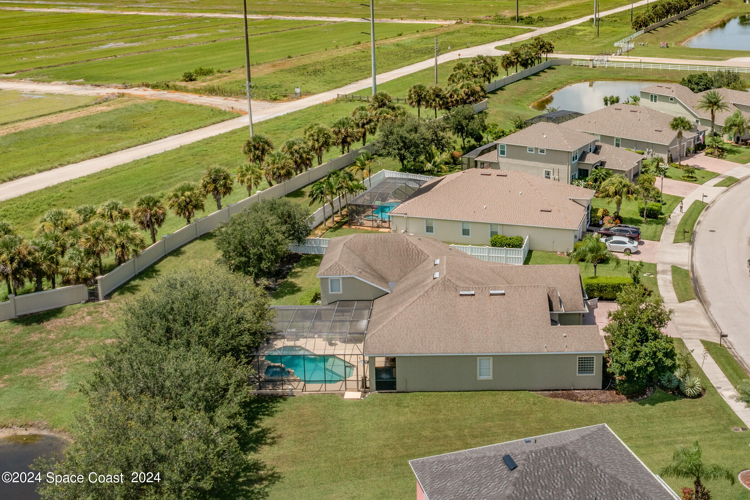 5972 Goleta Circle Melbourne, FL 32940 - Photo 55 of 56 a aerial view of a house with a yard