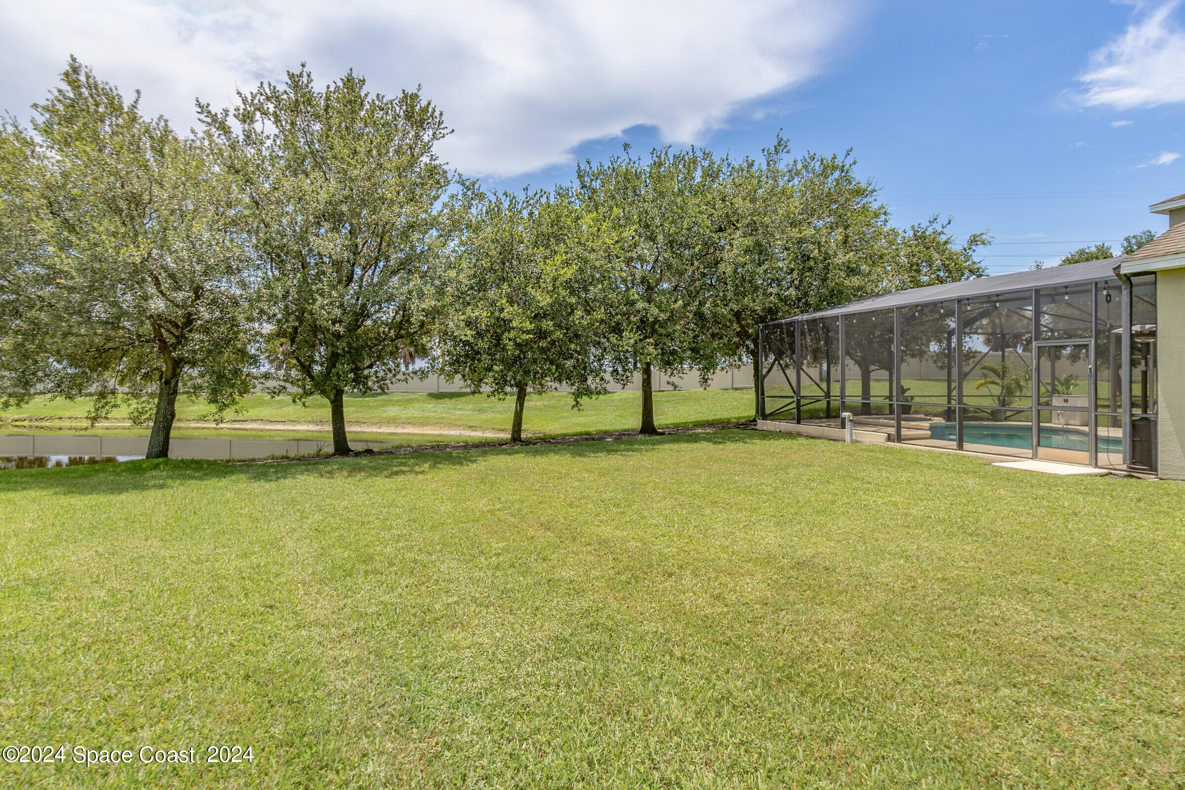 5972 Goleta Circle Melbourne, FL 32940 - Photo 7 of 56 a view of outdoor space with garden and trees