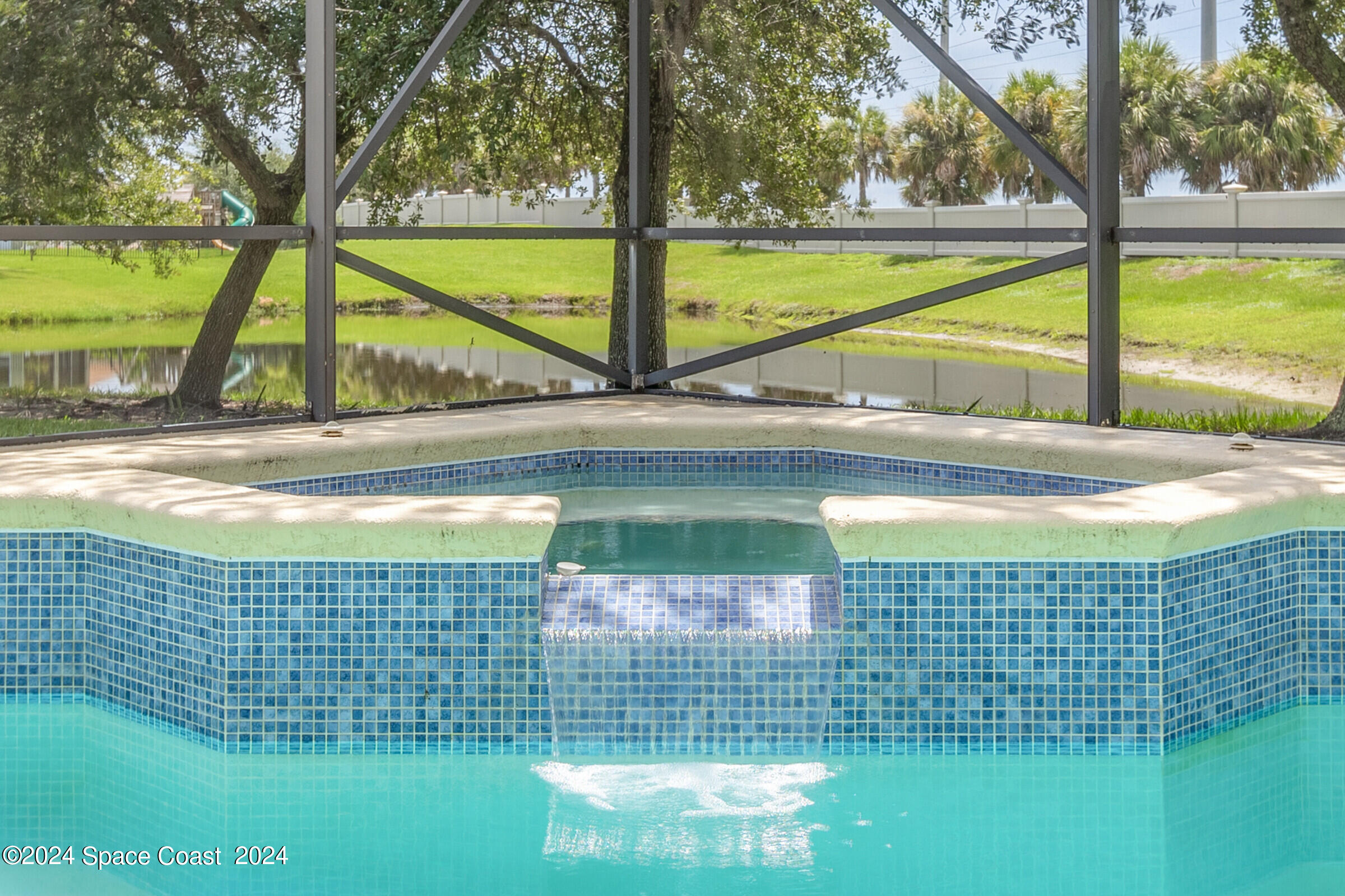 5972 Goleta Circle Melbourne, FL 32940 - Photo 9 of 56 a view of swimming pool from a yard