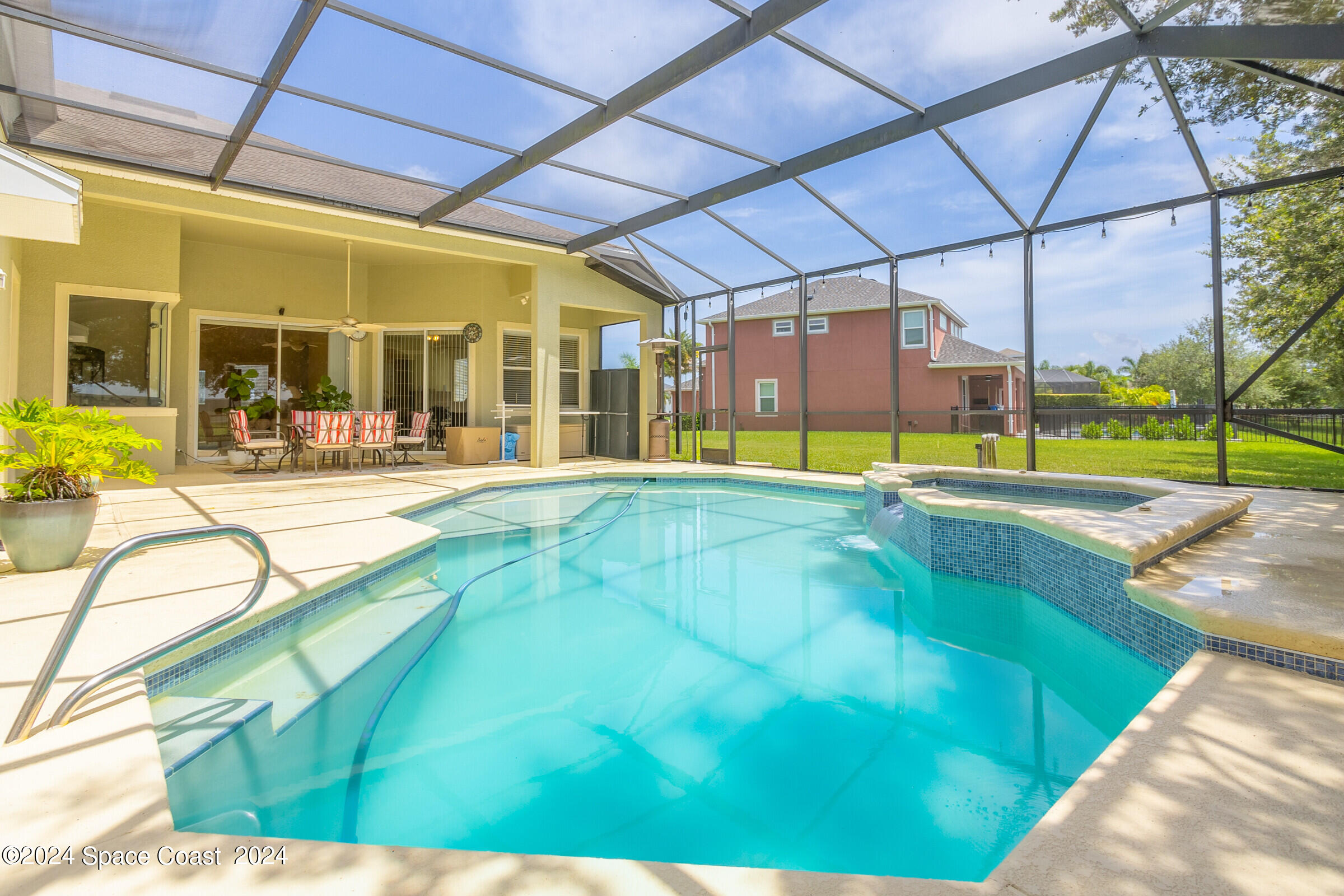 5972 Goleta Circle Melbourne, FL 32940 - Photo 10 of 56 a view of a swimming pool with a patio