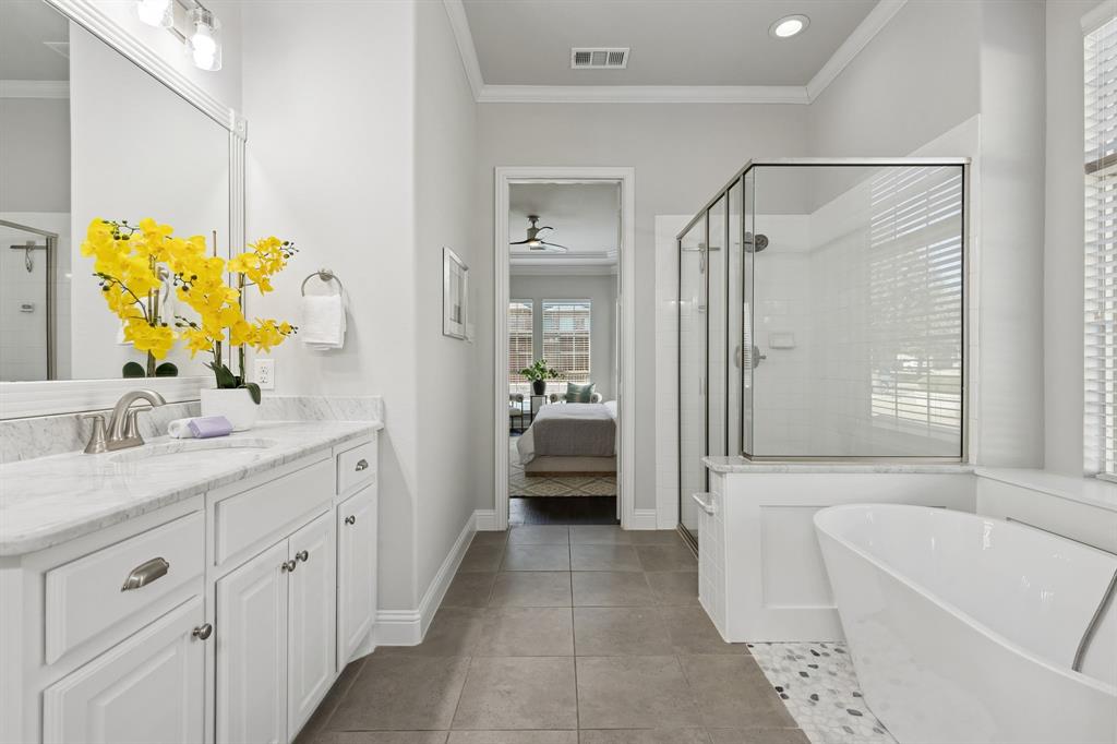 2816 Mona Vale Road Trophy Club, TX 76262 - Photo 17 of 40 a bathroom with a tub sink and mirror