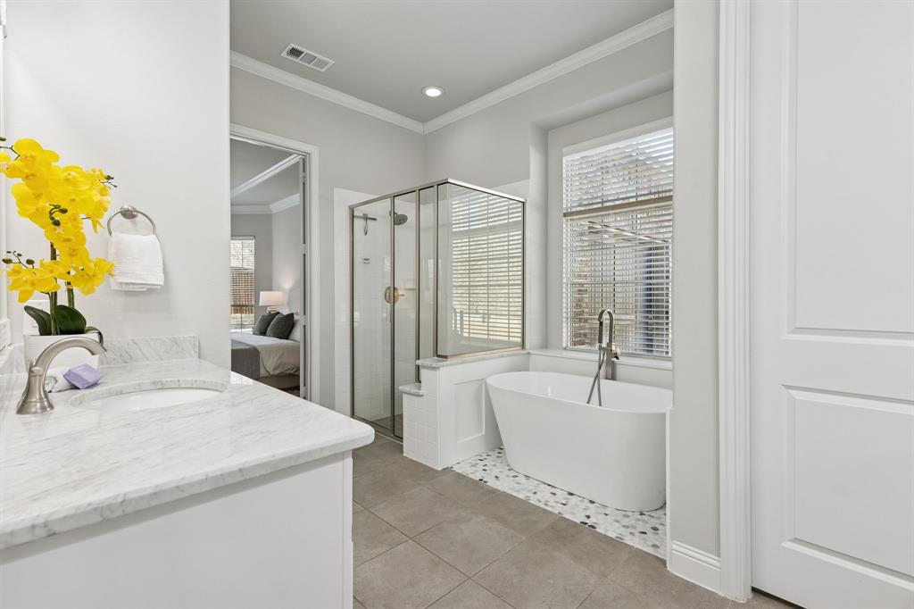 2816 Mona Vale Road Trophy Club, TX 76262 - Photo 18 of 40 a en suite bathroom with a tub sink and mirror